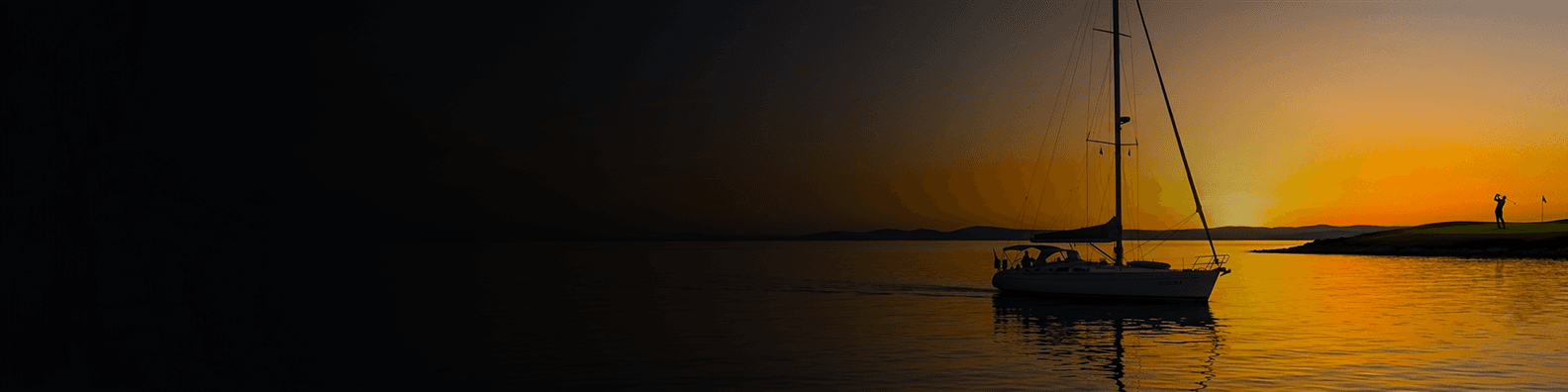 Sunset over the ocean with a sailboat
